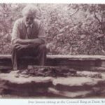 Black & White Photo of Jens Jensen seated in one of his council rings.